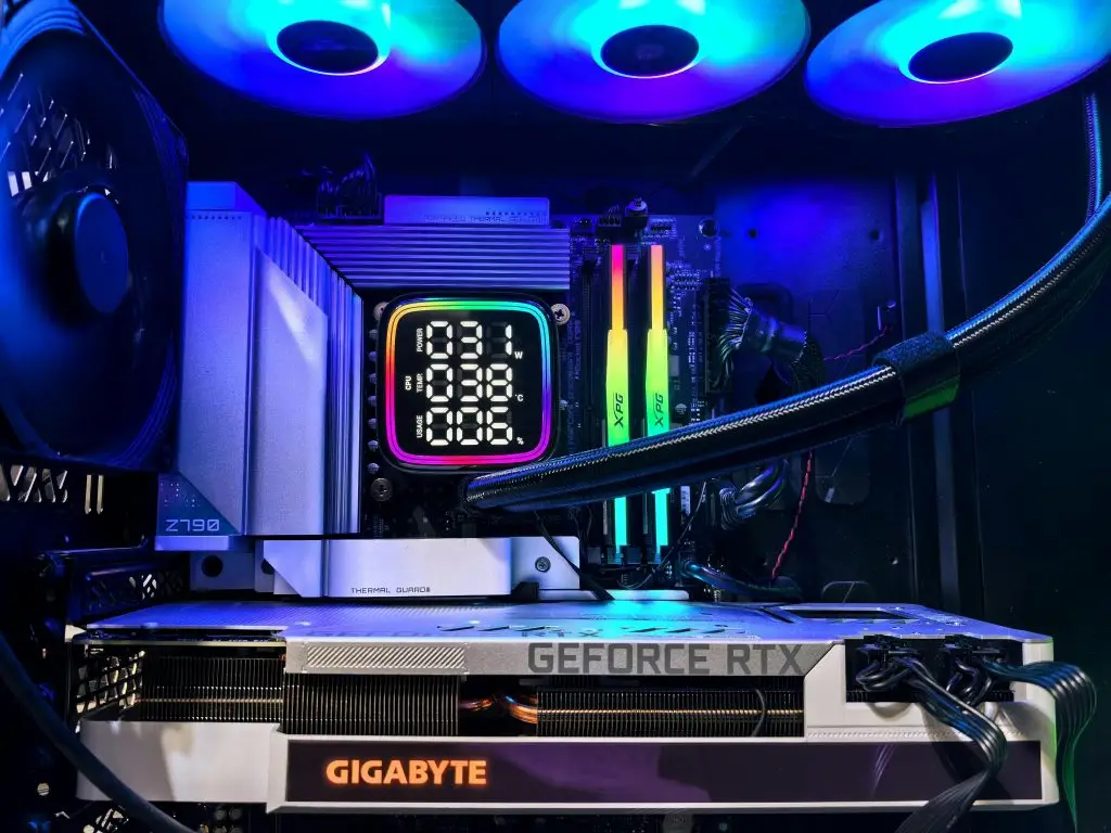 Vibrant RGB-lit gaming PC interior showcasing GeForce RTX and GIGABYTE components.